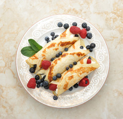 pancakes with cottage cheese and berries. top view