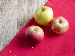 apples on a red cloth