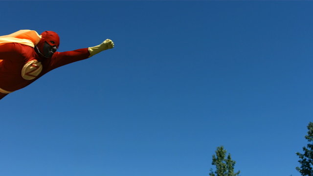 Superhero flying across sky, slow motion