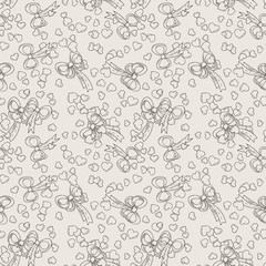Seamless pattern with bows and hearts.