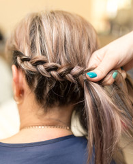 Naklejka premium weave braids in the beauty salon