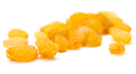Golden raisins on a white background