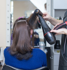 Fototapeta premium blow-drying in a beauty salon