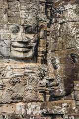 Smiling face decorating the Bayon temple in the ancient city of