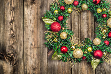 Christmas wreath on wooden background
