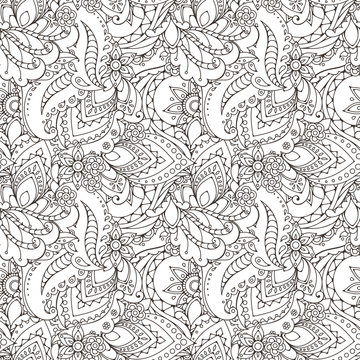 Seamless pattern of abstract flowers and paisley elements in Indian mehendi style.