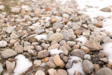 stones in the snow on the nature