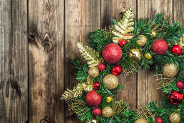 Christmas wreath on wooden background © alicja neumiler