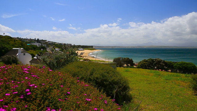Republic of South Africa. Mossel Bay (Mosselbaai) in Western Cape Province. Botanical garden of the Bartolomeu Dias Museum Complex and Santos Beach in background