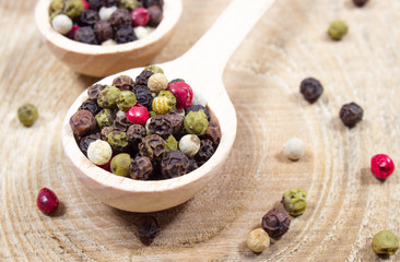Color pepper on a wooden background.