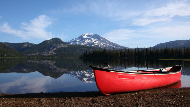 Canoe by lake shore, timelapse