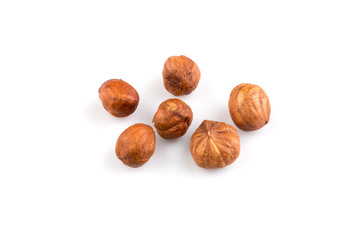 Hazelnuts on the white background