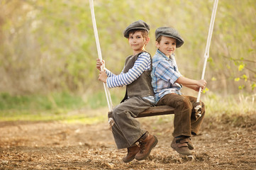 Children on swings sunny summer day