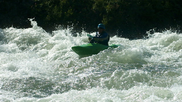 Kayaking in white water, super slow motion