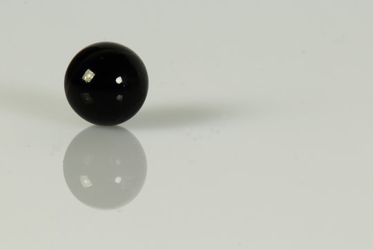 black glass marbels isolated on whit background