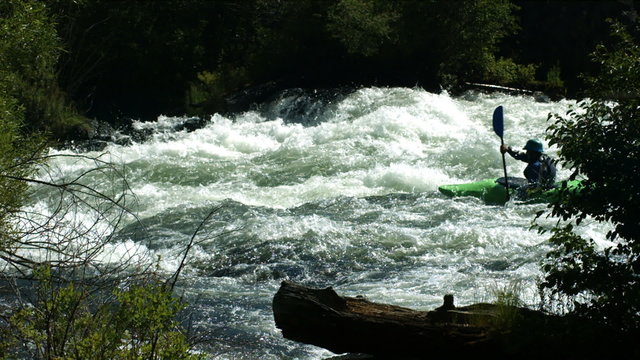 Kayaking down river, slow motion