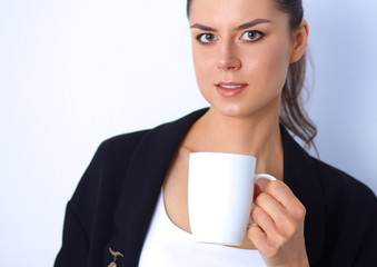 Young woman holding a mug, isolated on white background