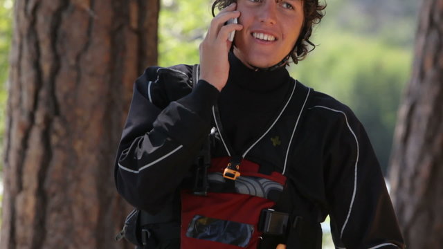Kayaker talking on cell phone