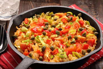 Fototapeta na wymiar Rice with vegetables baked in a pan