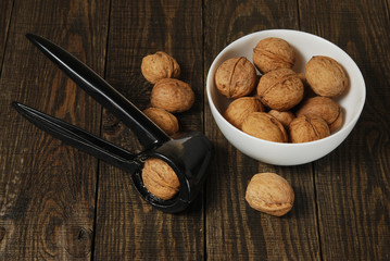Walnuts on the wooden background