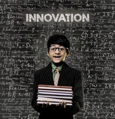 Innovation. Genius Little Boy Holding Book Wearing Glasses Chalk