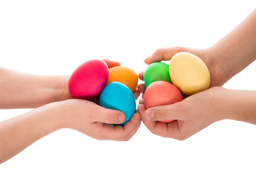 pile of easter eggs in two child hands