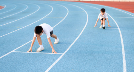 Running boy prepare to start