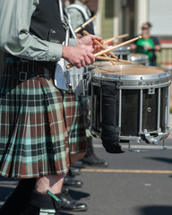 Close view of hands of Irish drum line for the marching band.