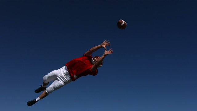 Football player misses catch, slow motion