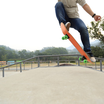 young skateboarder skateboarding at skatepark