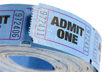 Roll of blue admit one movie cinema concert or theater ticket isolated on white background photo