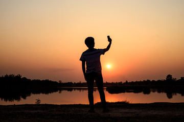 Fototapeta premium selfie on sunset background