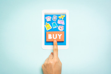 Hand finger touching button buy on tablet computer concept