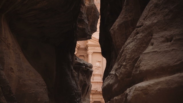 A view of the Treasury building through the Siq in Petra
