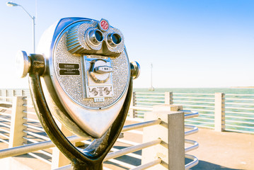 Coin Binoculars on the top over the beach view
