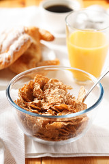 Cornflakes with croissant  for breakfast
