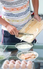 Foto op Canvas Man preparing meal in the kitchen   © triocean