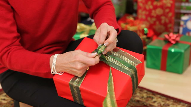 Tying a box on Christmas present