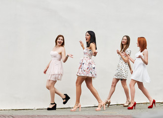 Fototapeta premium walking four young women