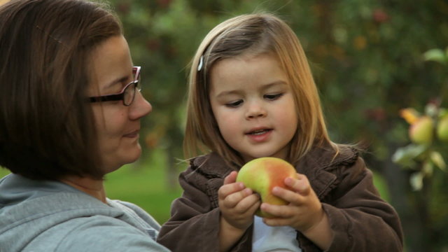 Mother and daughter go apple picking