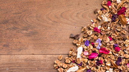 Naklejka na ściany i meble Top view workspace with dried flowers on wooden table background