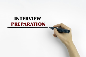 Hand with marker writing: Interview Preparation