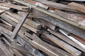 Pile of discarded lumber on plie of wood chips