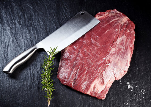 Cleaver with a lean raw shank steak