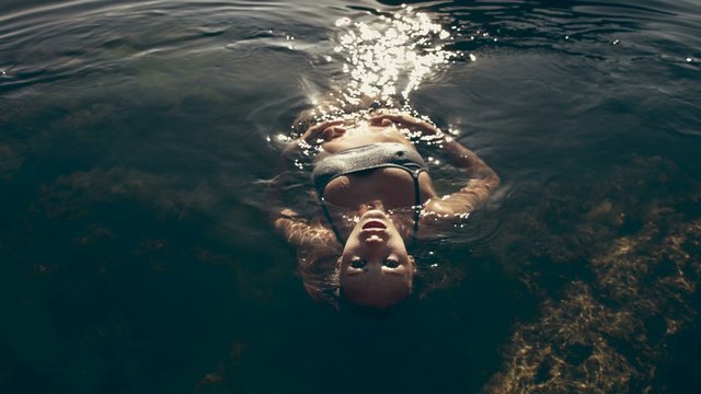Attractive Girl in a Bikini in water