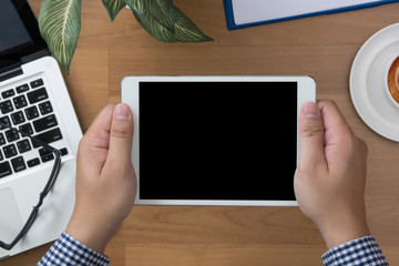 man hand Tablet with blank black screen and coffee