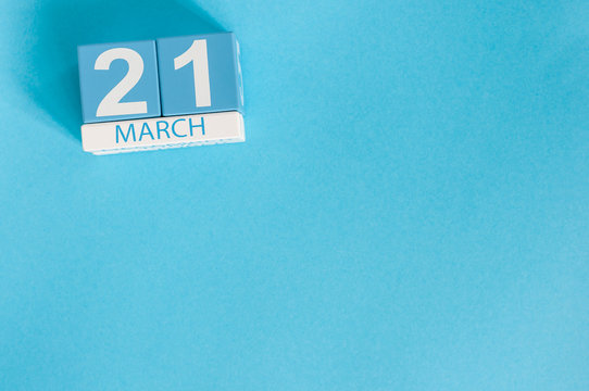 March 21st. Image of march 21 wooden color calendar on blue background.  Spring day, empty space for text. World Down Syndrome Day, International DAy Of Forests