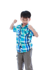 An aggressive asian child. Boy looking furious. Negative human face expressions concept.