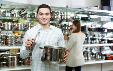 Smiling couple in the cookware section