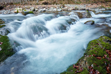 Fototapeta na wymiar River flowing through mountain